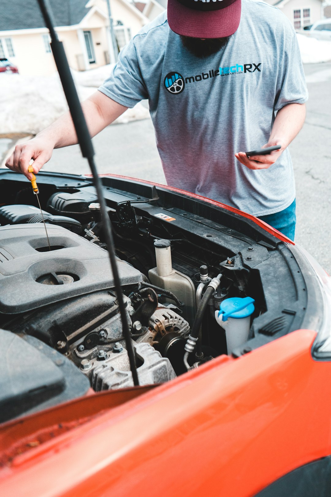 a-man-is-working-on-a-car-engine-7wxj05ijcsy