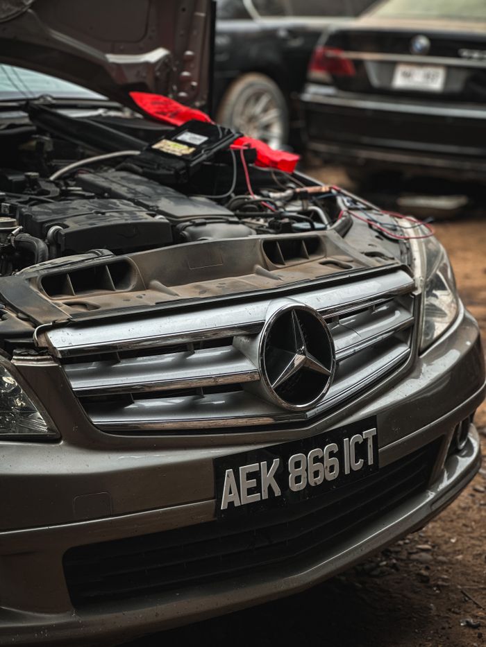 services-02 Detailed view of a Mercedes car engine bay with open hood in Peshawar, Pakistan.