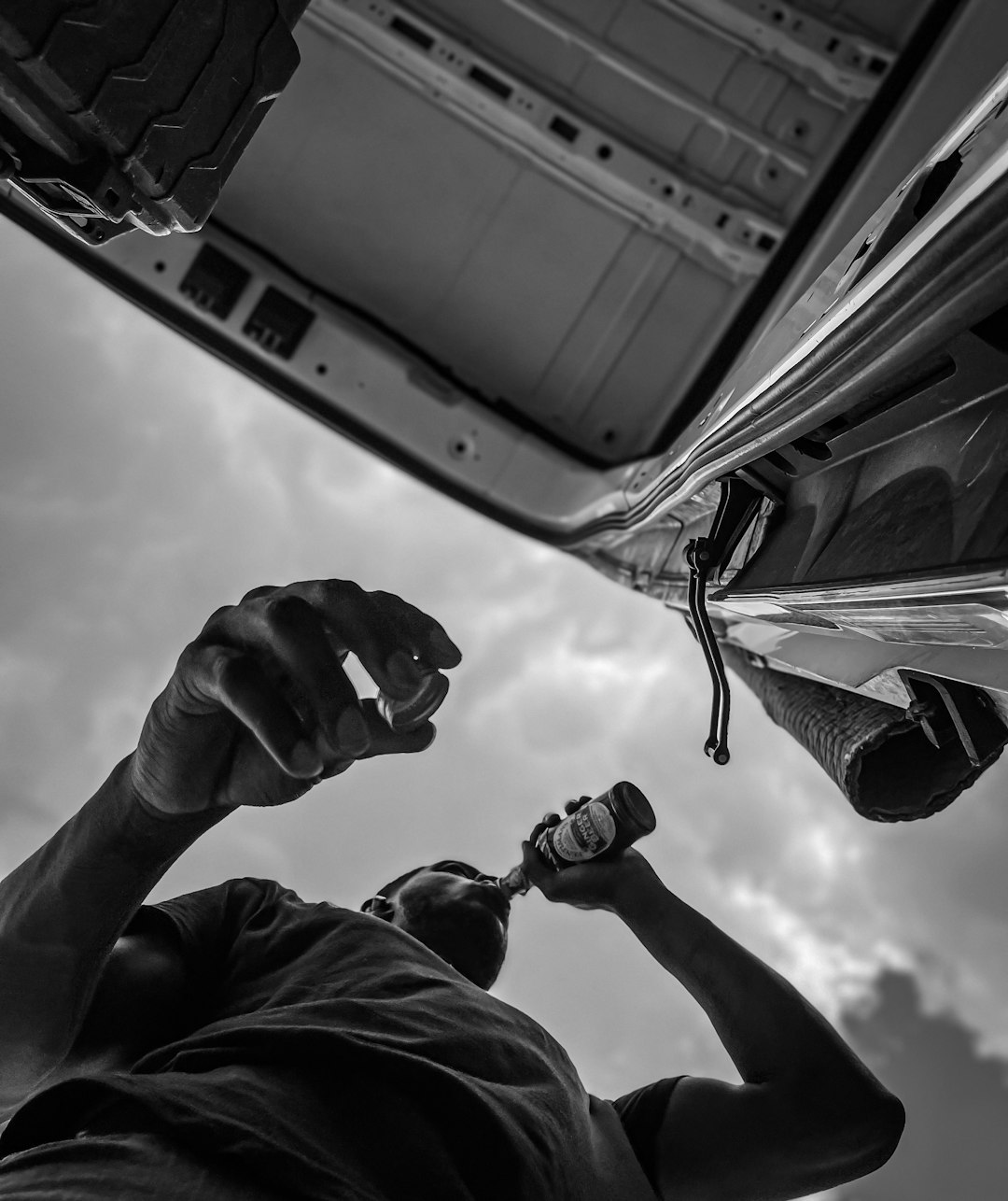 grayscale-photo-of-man-in-jacket-holding-smartphone-d1oo6hvhfya